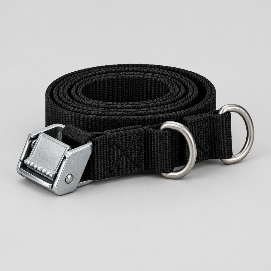Orbit Utility Strap in black webbing with cam buckle and D-rings, coiled
